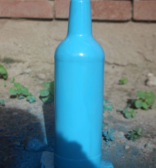 A discarded glass bottle to be used for an ornament painted by a member of the Waste Rescue Club Photo: Solomon Eko